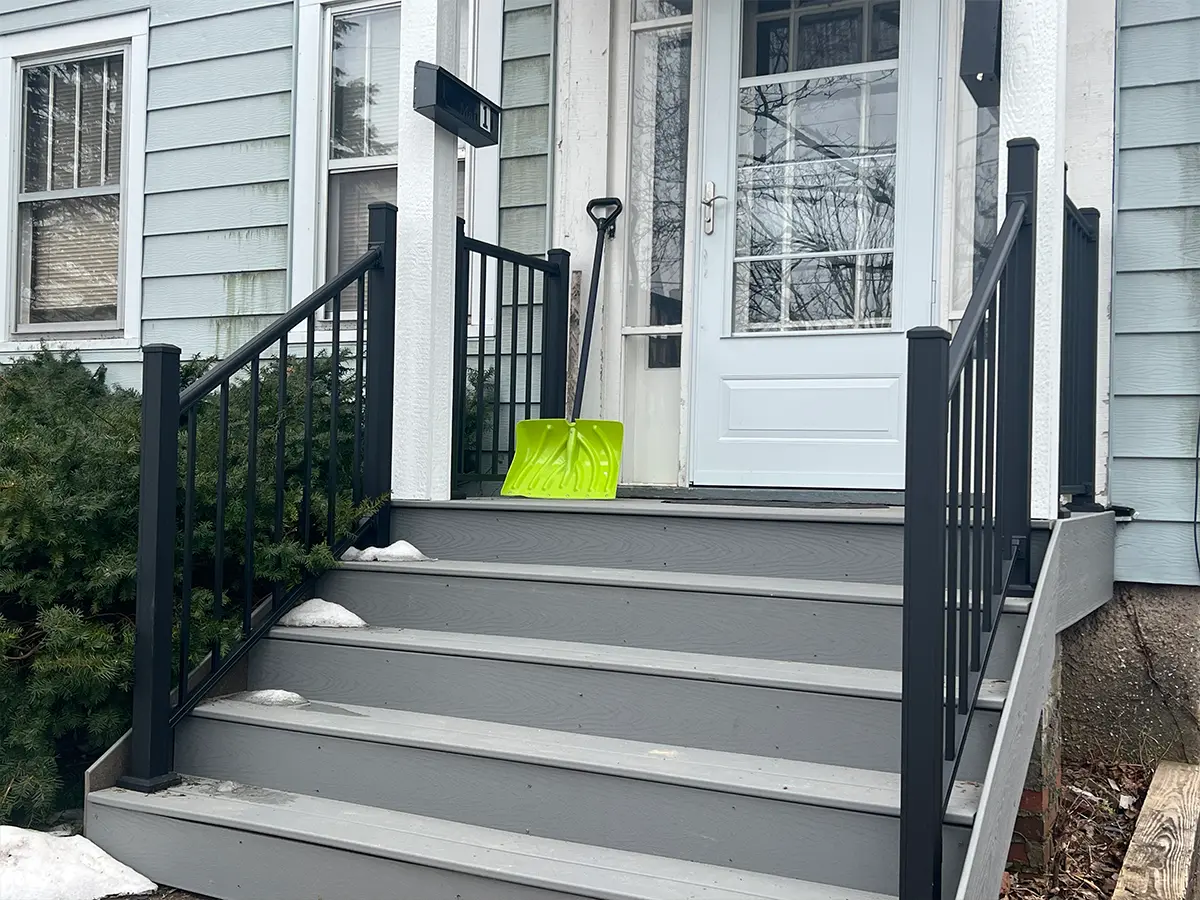 A set of stairs with metal handrails