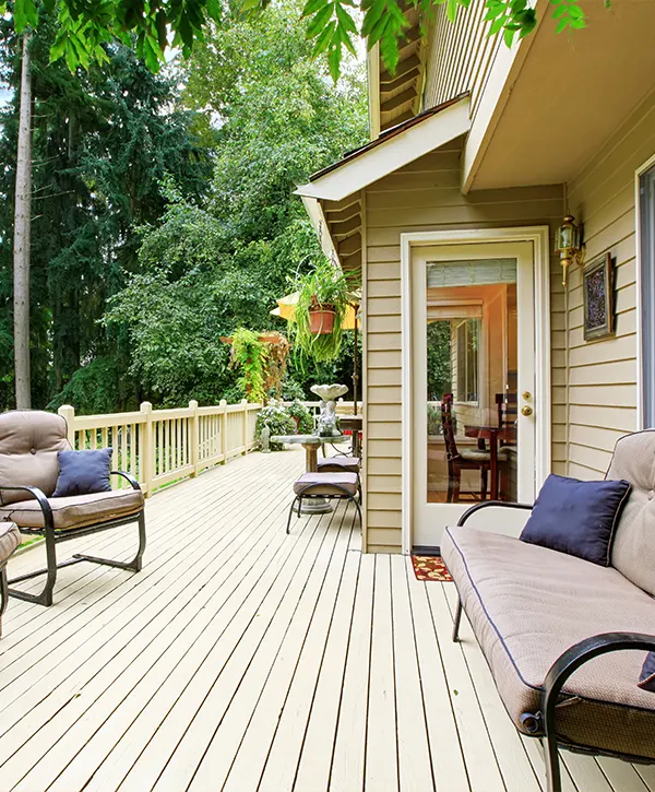 Deck repair in Waunakee, WI with beige wood decking and home siding